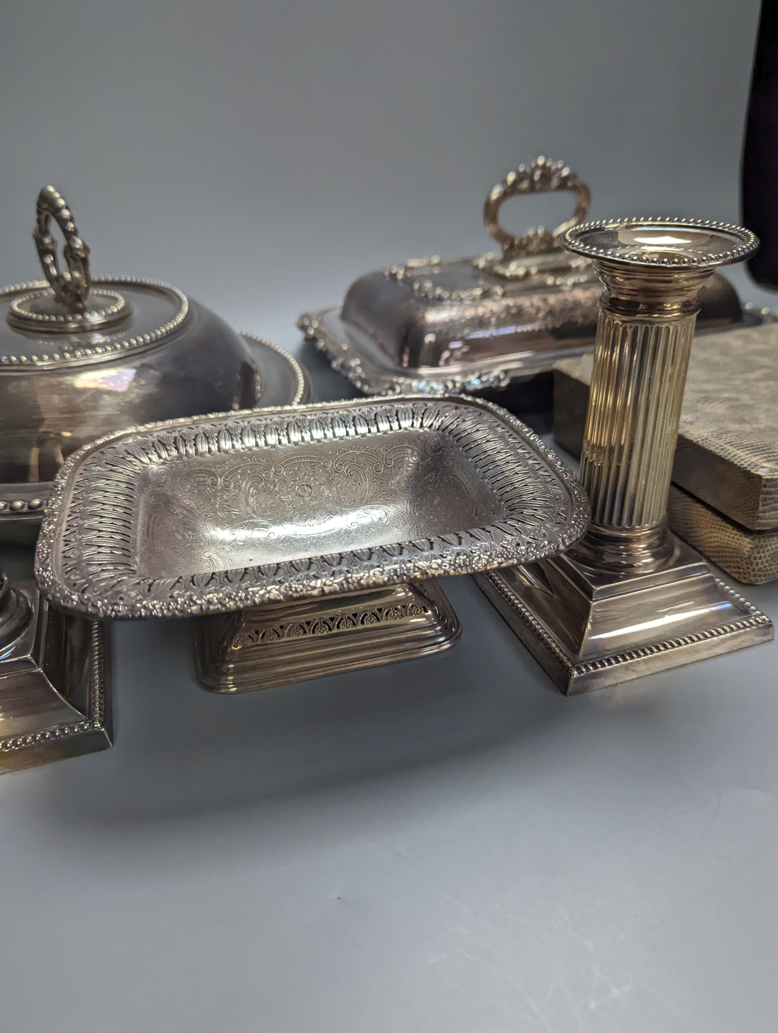 Six silver handled tea knives, two silver plated entree dishes, pair of candlesticks and other items